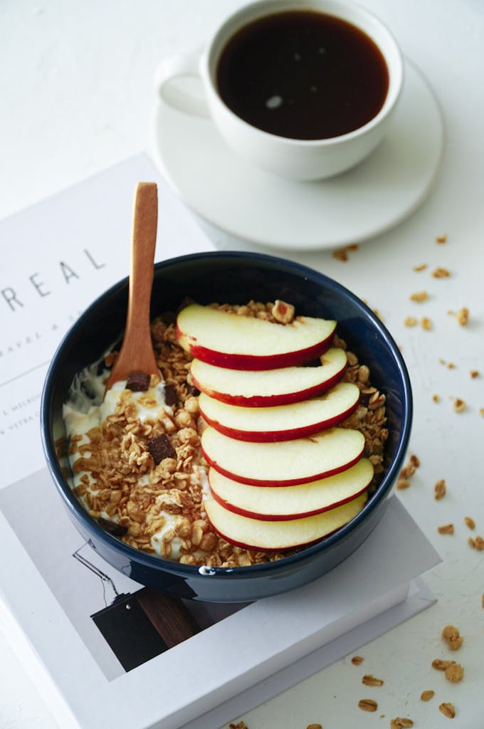 Delicious breakfast of apple muesli and black coffee served on a table in İstanbul.